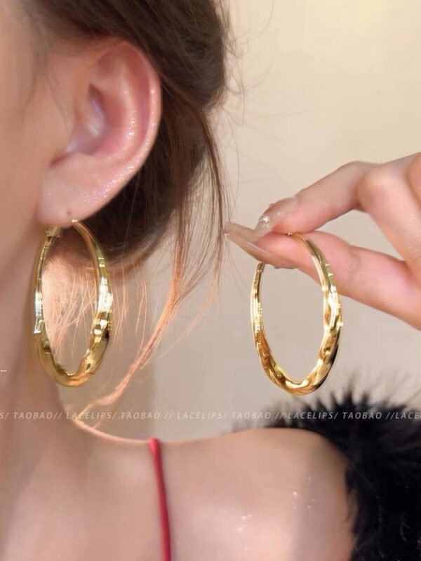 Fluid Wave Gold Hoops